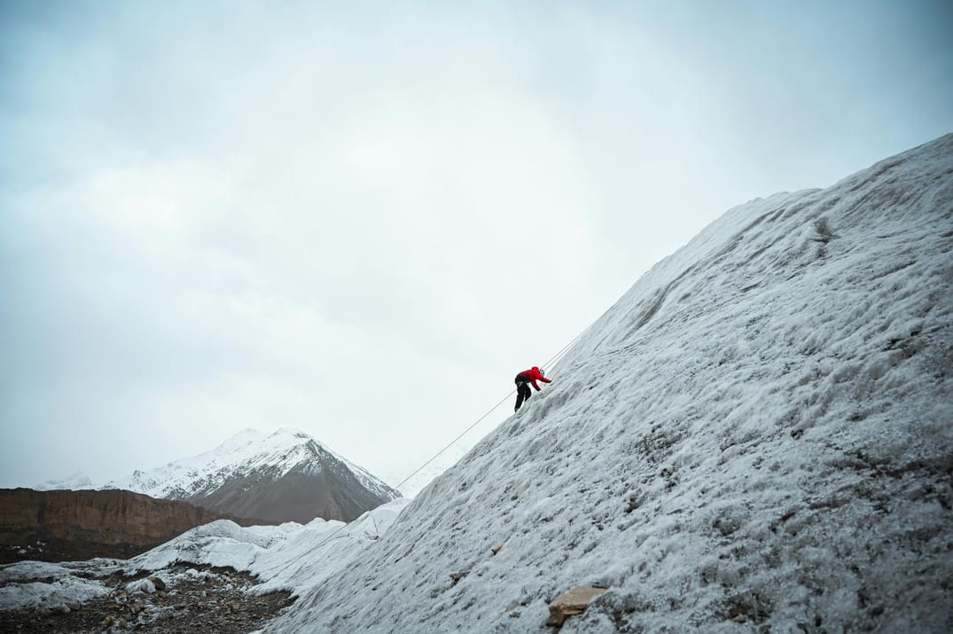 Person climbing a mountain